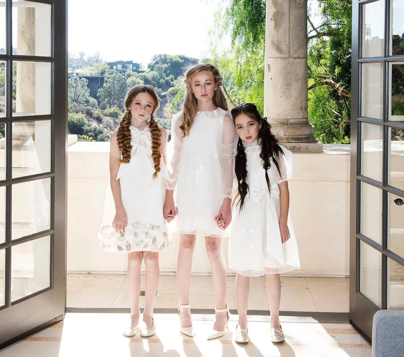 Children's luxury custom couture and formalwear for flowergirls, bar mitzvah, and quinceañera.