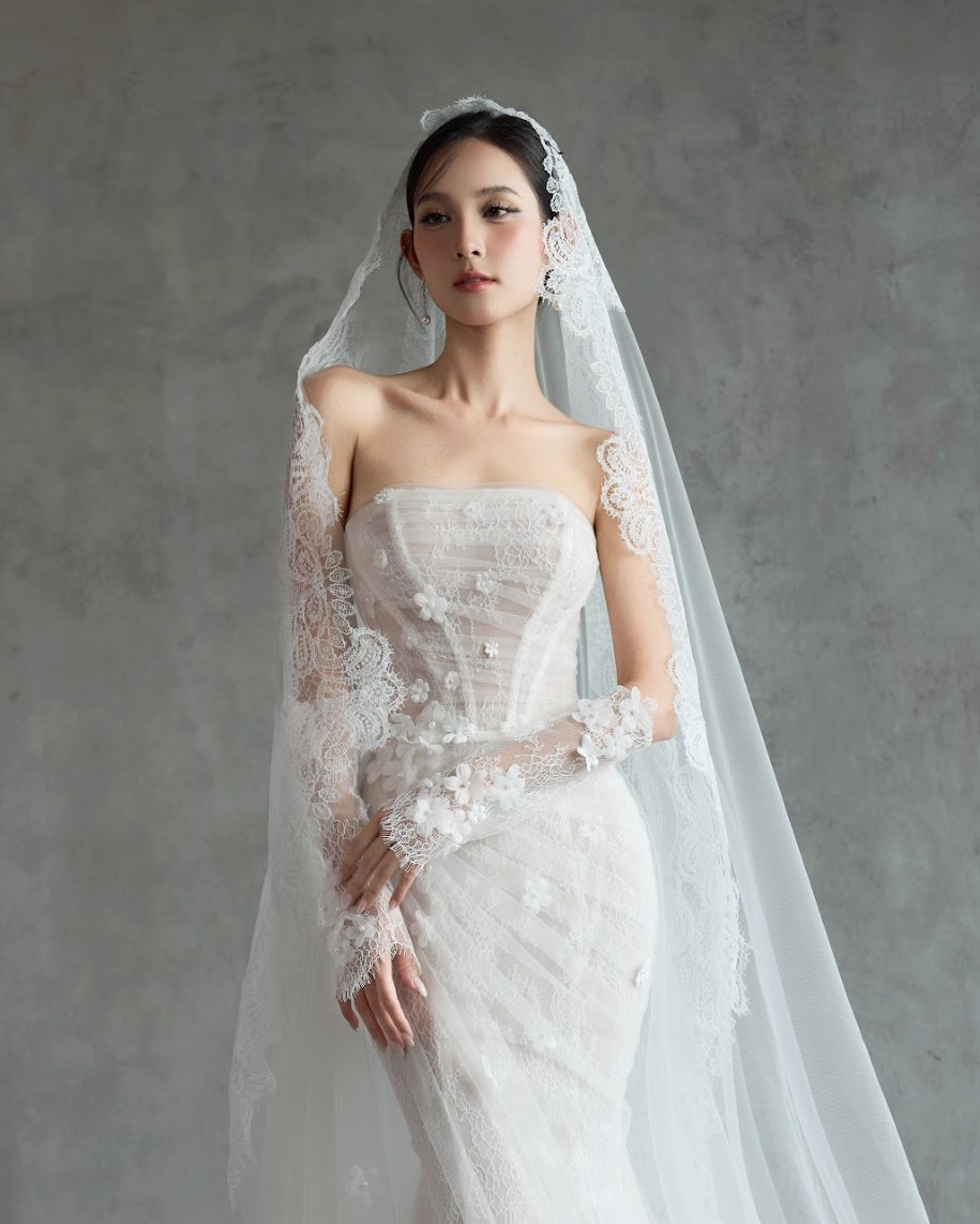 bride in luxury floral  bespoke couture  custom wedding dress with chantilly lace and cathedral veil in nancy vuu designs serving silicon valley for couple's cohesive styling. 